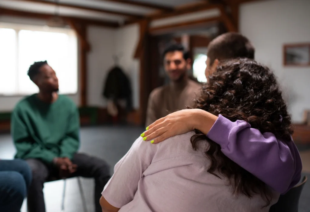 People helping each other in a support group