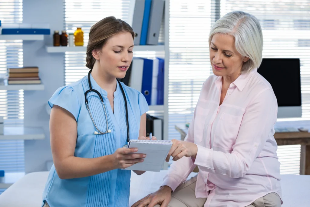 A woman talking to a healthcare professional